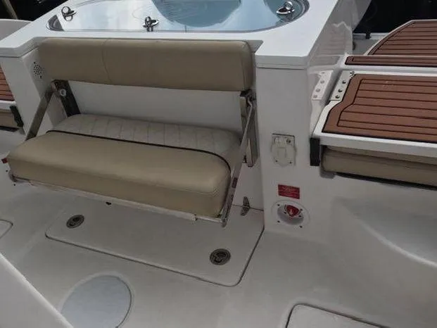 Slide: The Image of 2017 Sea Fox 288 Commander boat interior with beige seating and teak accents. - 7