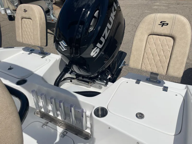 Slide: The Image of 2024 Sea Pro 202 CC boat interior with cushioned seating and storage compartments. - 11