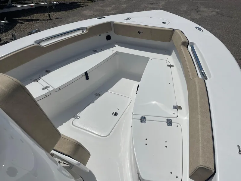 Slide: The Image of 2024 Sea Pro 202 CC boat interior with cushioned seating and storage compartments. - 4