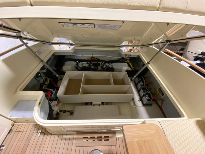 Slide: The Image of 2024 Chris-Craft LAUNCH GT 35 engine compartment with open hatch. - 13