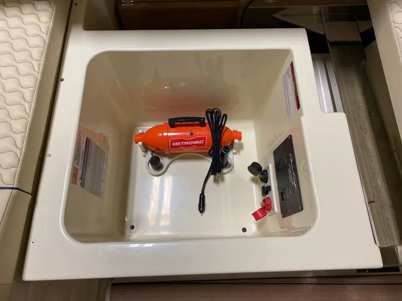 Slide: The Image of 2024 Chris-Craft LAUNCH GT 35 storage compartment with Metrovac vacuum. - 14