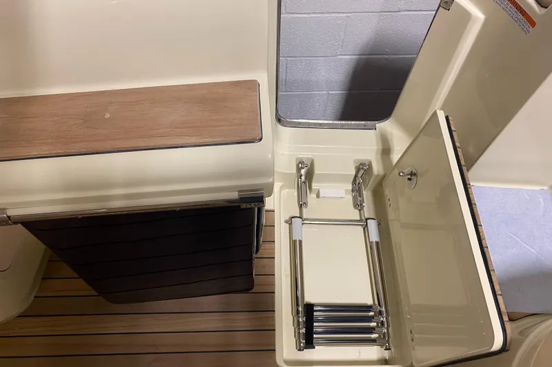 Slide: The Image of 2024 Chris-Craft LAUNCH GT 35 boat with integrated swim ladder and teak flooring. - 16
