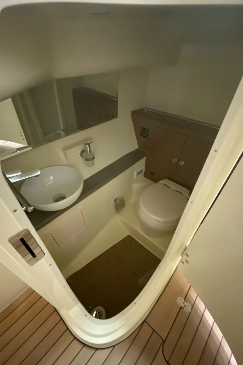 Slide: The Image of 2024 Chris-Craft LAUNCH GT 35 bathroom with modern fixtures and wooden flooring. - 24