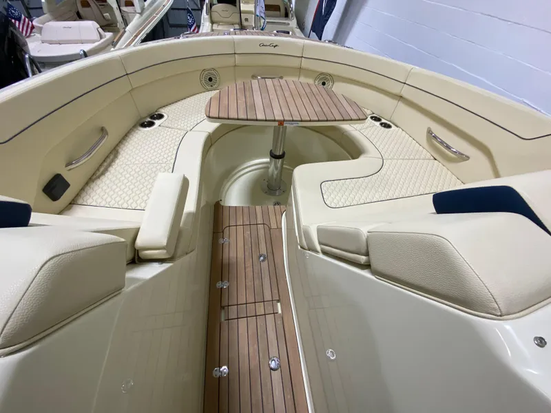 Slide: The Image of Luxurious interior of the 2024 Chris-Craft LAUNCH GT 35 with teak flooring and seating area. - 28