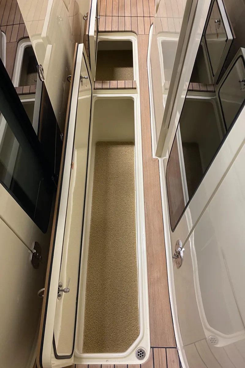 Slide: The Image of 2024 Chris-Craft LAUNCH GT 35 storage compartments on deck. - 32