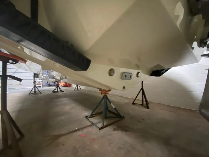 Slide: The Image of 2024 Chris-Craft LAUNCH GT 35 boat hull on stands in a storage facility. - 35