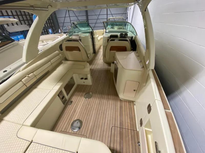 Slide: The Image of 2024 Chris-Craft LAUNCH GT 35 interior with luxurious seating and wooden flooring. - 7