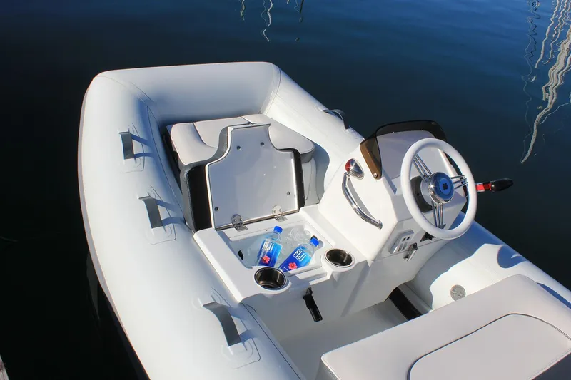 Slide: The Image of 2023 Walker Bay 365 STX Deluxe boat interior with Yamaha 25HP engine components. - 7