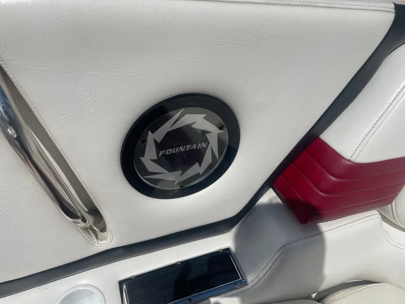 Slide: The Image of Interior of a 1995 Fountain 42 Executioner boat with logo and red accents. - 10