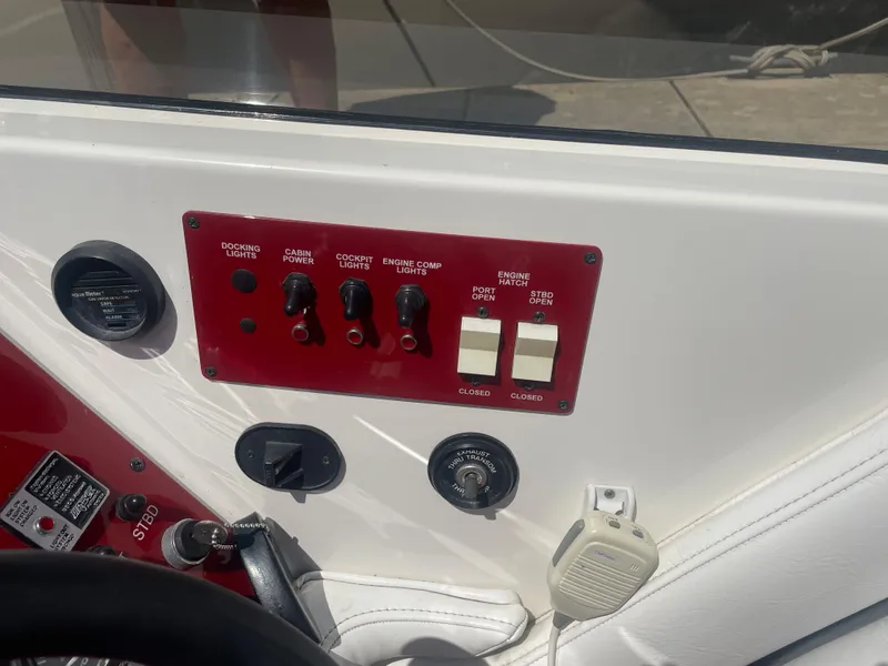 Slide: The Image of Control panel of a 1995 Fountain 42 Executioner boat with various switches and gauges. - 12