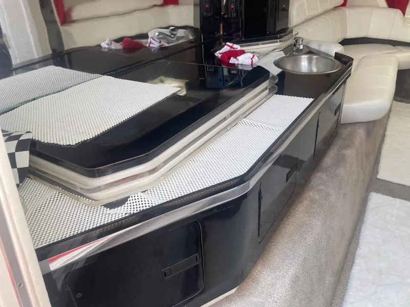 Slide: The Image of Interior of 1995 Fountain 42 Executioner boat with kitchenette and seating area. - 14