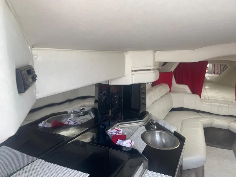 Slide: The Image of Interior of 1995 Fountain 42 Executioner boat with white leather seating and kitchenette. - 15