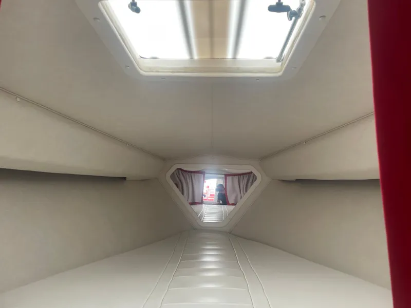 Slide: The Image of Interior cabin of a 1995 Fountain 42 Executioner boat with skylight. - 18