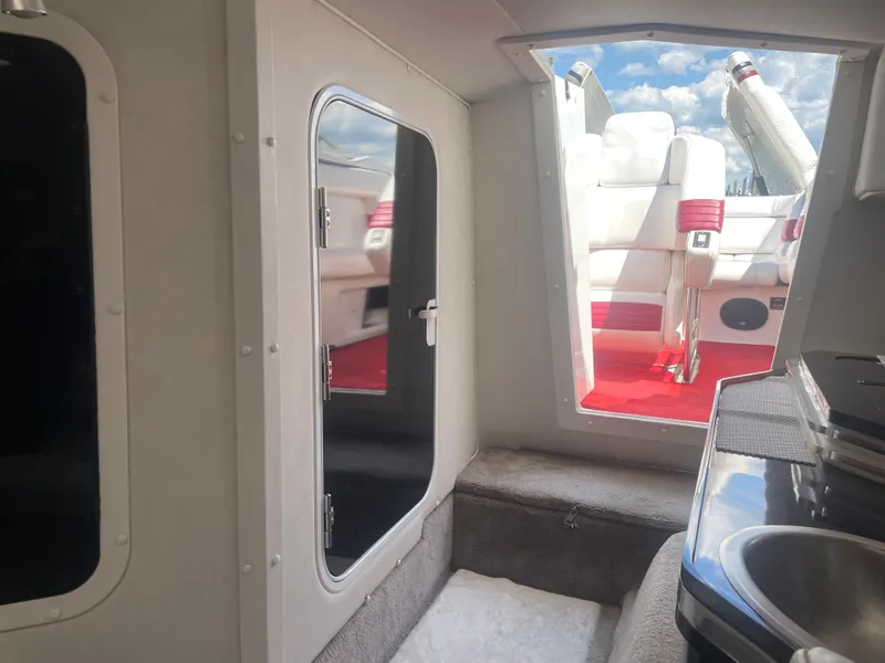 Slide: The Image of Interior of 1995 Fountain 42 Executioner boat with view of cockpit and seating area. - 21