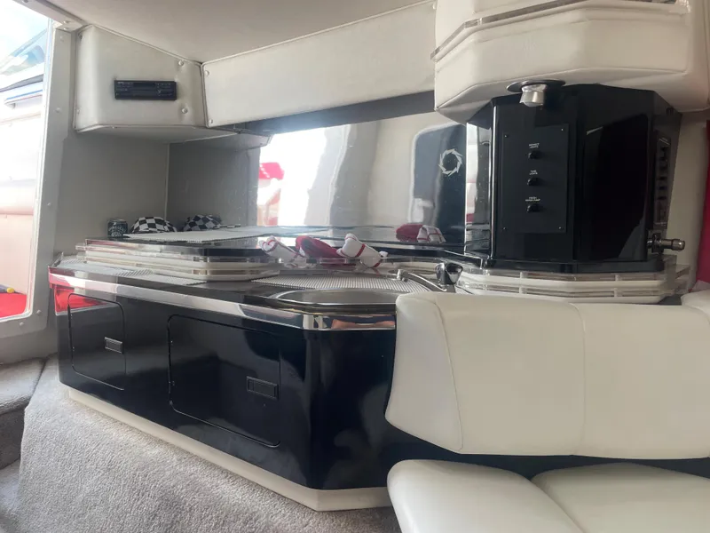 Slide: The Image of Interior of a 1995 Fountain 42 Executioner boat with modern kitchen amenities. - 22