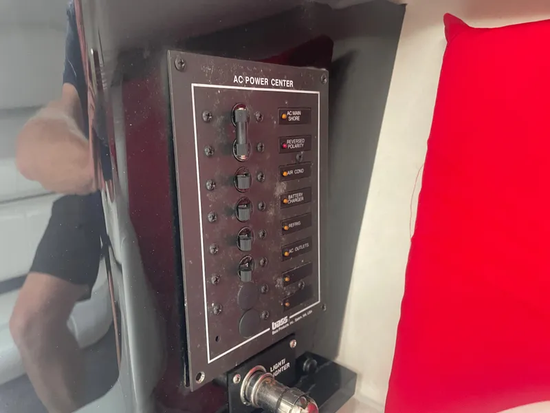 Slide: The Image of AC power center panel in a 1995 Fountain 42 Executioner boat. - 23