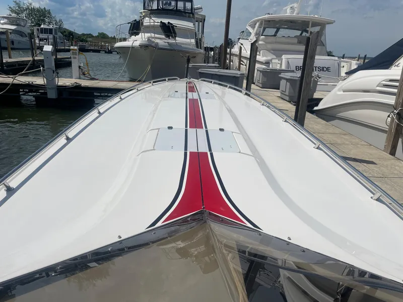 Slide: The Image of 1995 Fountain 42 Executioner speedboat docked at marina, top view. - 4