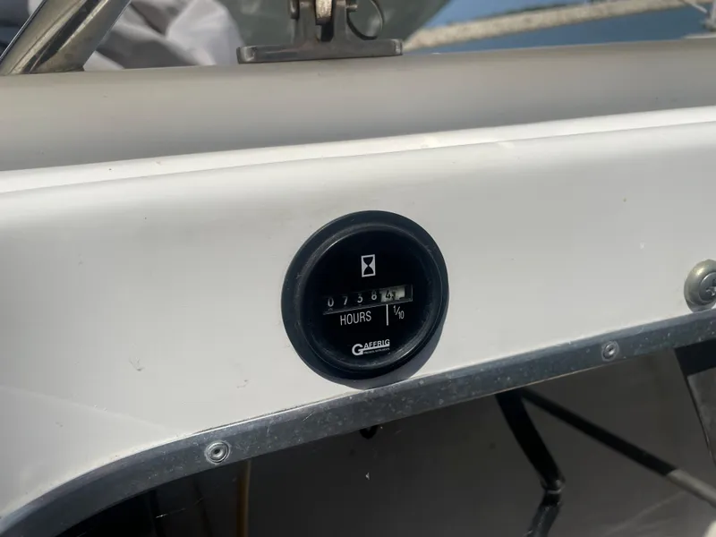 Slide: The Image of Hour meter on a 1995 Fountain 42 Executioner boat dashboard. - 5