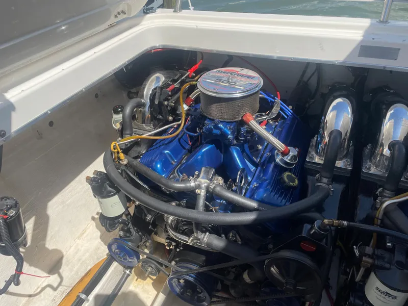 Slide: The Image of 1995 Fountain 42 Executioner engine compartment with blue engine and chrome components. - 6