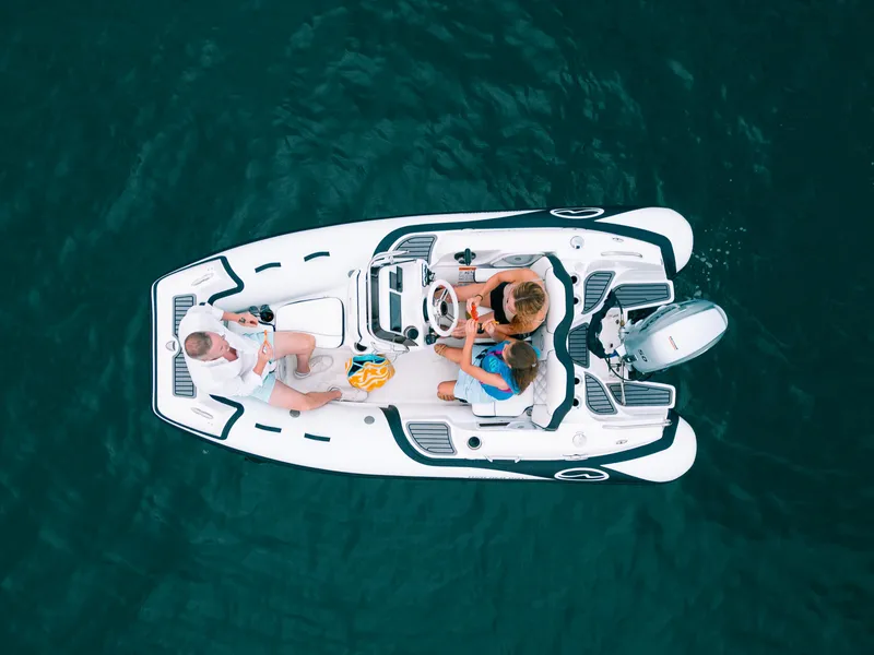 Slide: The Image of Aerial view of 2024 Walker Bay Generation 12 boat with passengers on water. - 3