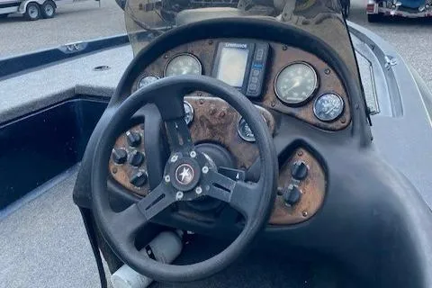 Slide: The Image of 2002 Stratos 17 XL boat dashboard with steering wheel and instrument panel. - 6