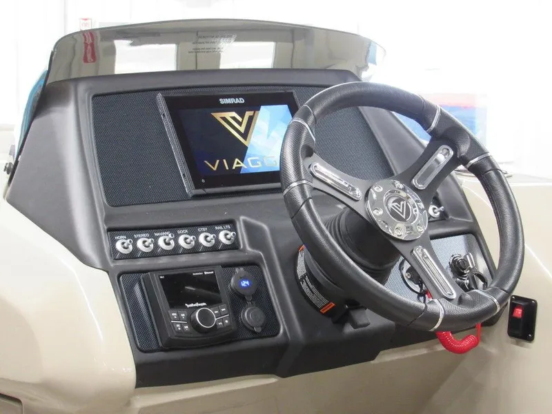 Slide: The Image of 2023 Viaggio Diamante U D21U boat dashboard with steering wheel and control panel. - 12