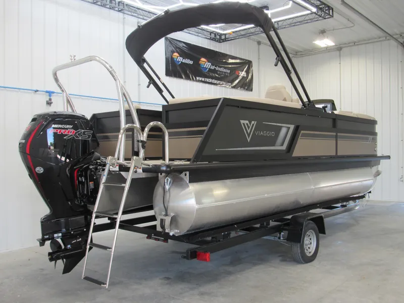 Slide: The Image of 2023 Viaggio Diamante U D21U pontoon boat with Mercury outboard motor in a showroom. - 2