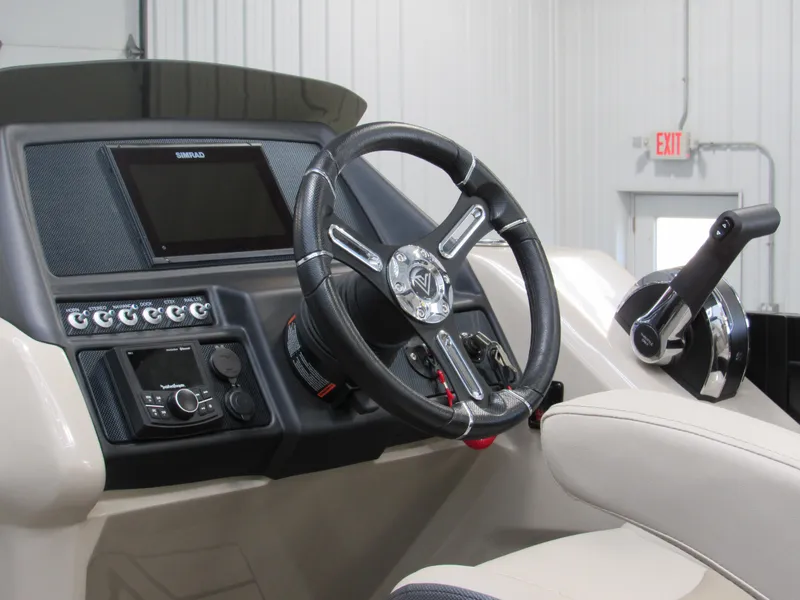 Slide: The Image of 2023 Viaggio Diamante U D21U boat dashboard with steering wheel and control panel. - 21