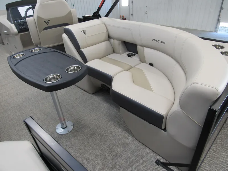 Slide: The Image of 2023 Viaggio Diamante U D21U boat interior with plush seating and table. - 4