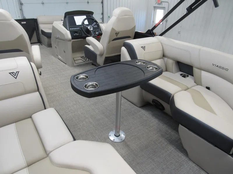 Slide: The Image of Luxurious interior of 2023 Viaggio Diamante U D21U pontoon boat with plush seating and table. - 5