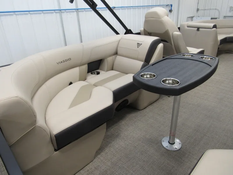 Slide: The Image of 2023 Viaggio Diamante U D21U boat interior with beige seating and table. - 6
