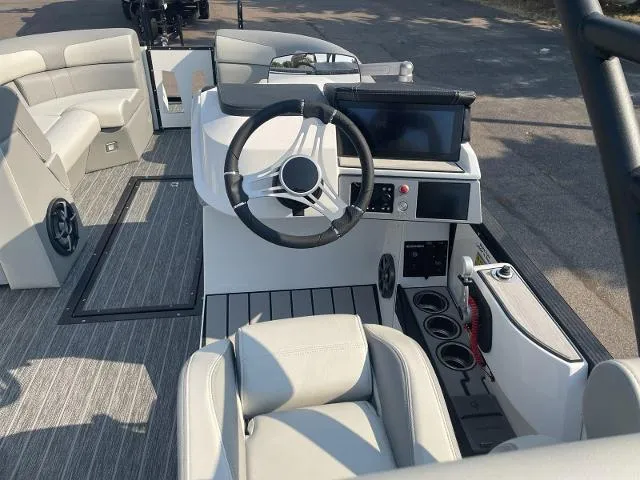 Slide: The Image of 2022 Montara Surf Boss 2.0 boat interior with steering wheel and seating. - 13