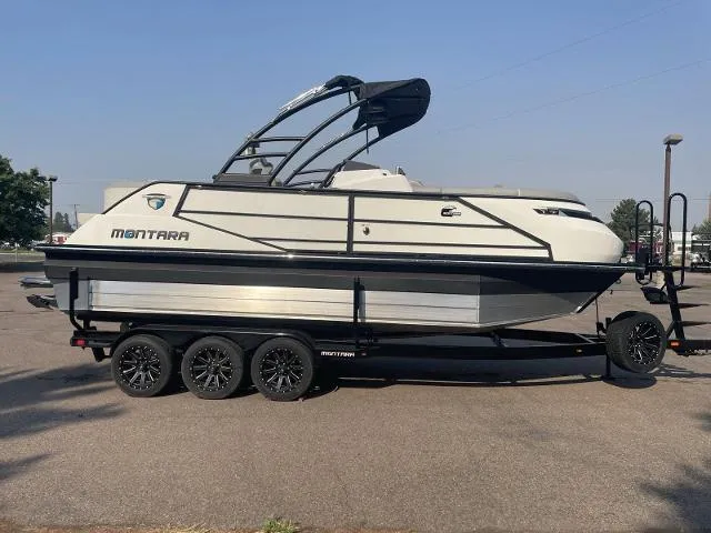 Slide: The Image of 2022 Montara Surf Boss 2.0 boat on a trailer in a parking lot. - 4