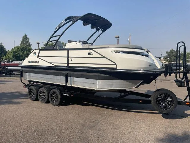 Slide: The Image of 2022 Montara Surf Boss 2.0 boat on a trailer in a parking lot. - 6