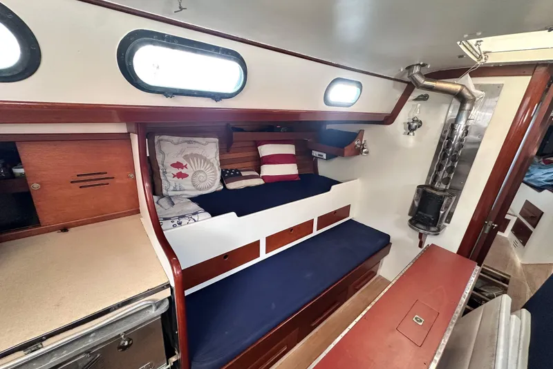 Slide: The Image of Interior of 1962 Hinckley Bermuda 40 sailboat with cozy seating and nautical decor. - 30