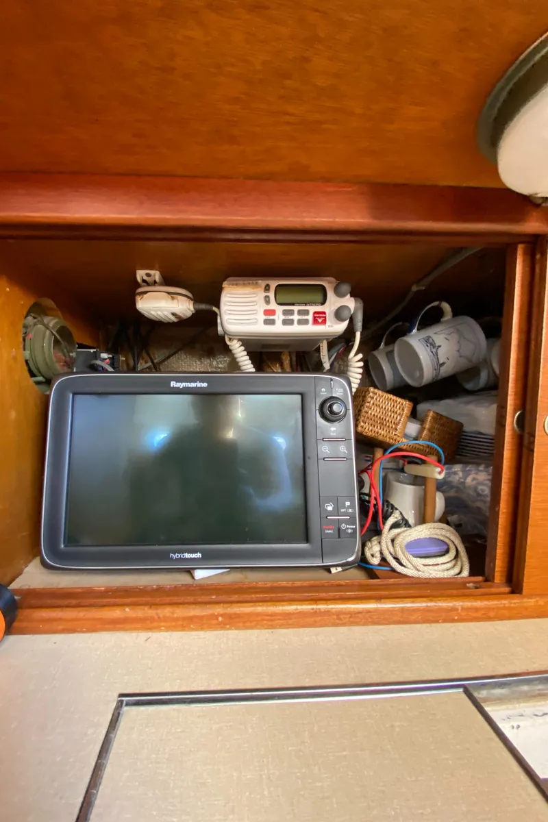 Slide: The Image of Navigation equipment inside a 1962 Hinckley Bermuda 40 sailboat cabin. - 22