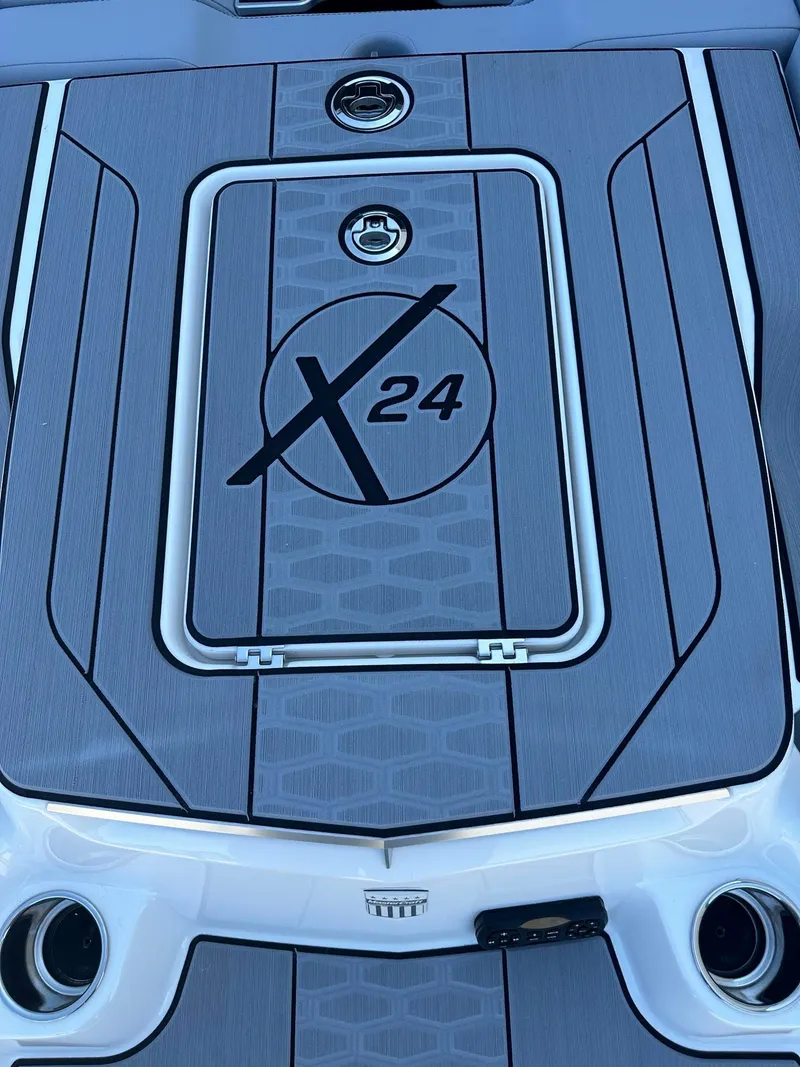 Slide: The Image of 2024 MasterCraft X24 boat deck with logo and sleek design. - 3