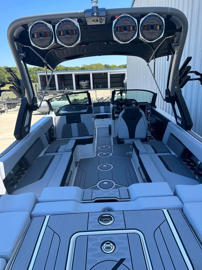 Slide: The Image of 2024 MasterCraft X24 boat interior with advanced audio system and luxurious seating. - 4