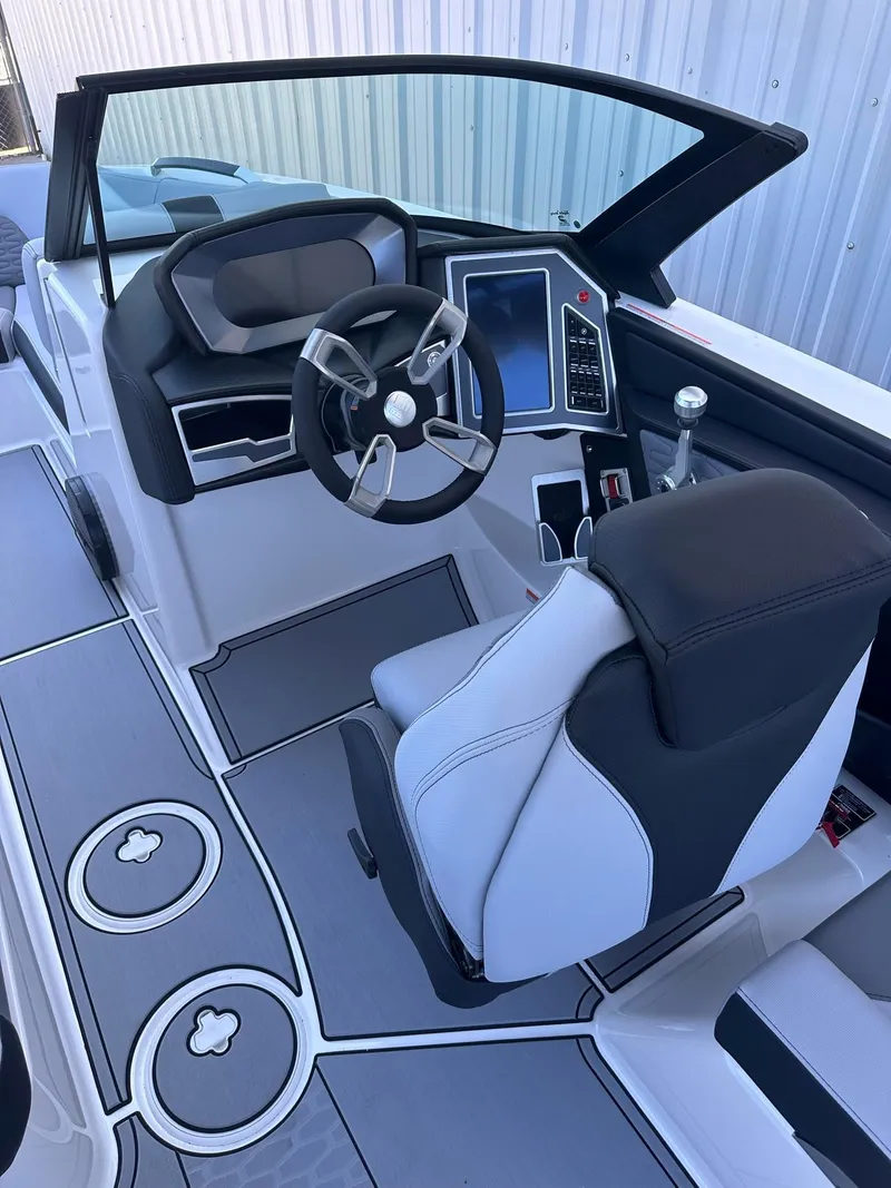 Slide: The Image of 2024 MasterCraft X24 boat interior with modern dashboard and steering wheel. - 5