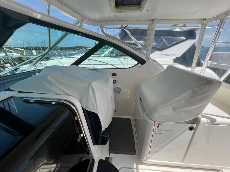 Slide: The Image of 2004 Tiara Yachts 3200 Open cockpit with covered seats and helm station. - 11