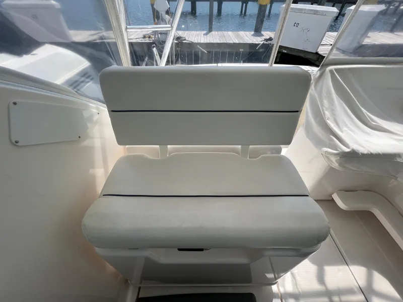 Slide: The Image of Tiara Yachts 3200 Open 2004 model, white cushioned seat in cockpit area. - 13