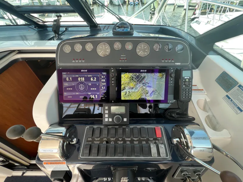Slide: The Image of Tiara Yachts 3200 Open 2004 helm with navigation screens and controls. - 15