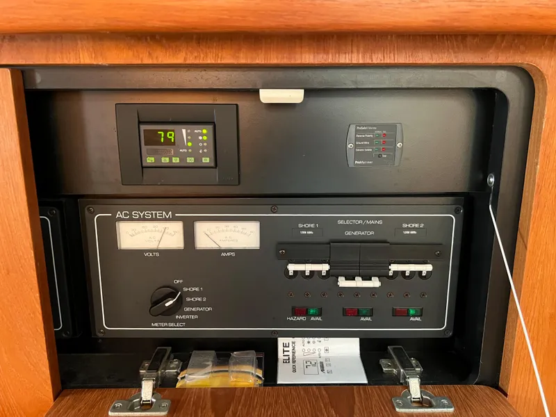 Slide: The Image of Control panel of a 2004 Tiara Yachts 3200 Open, showing AC system and temperature display. - 25