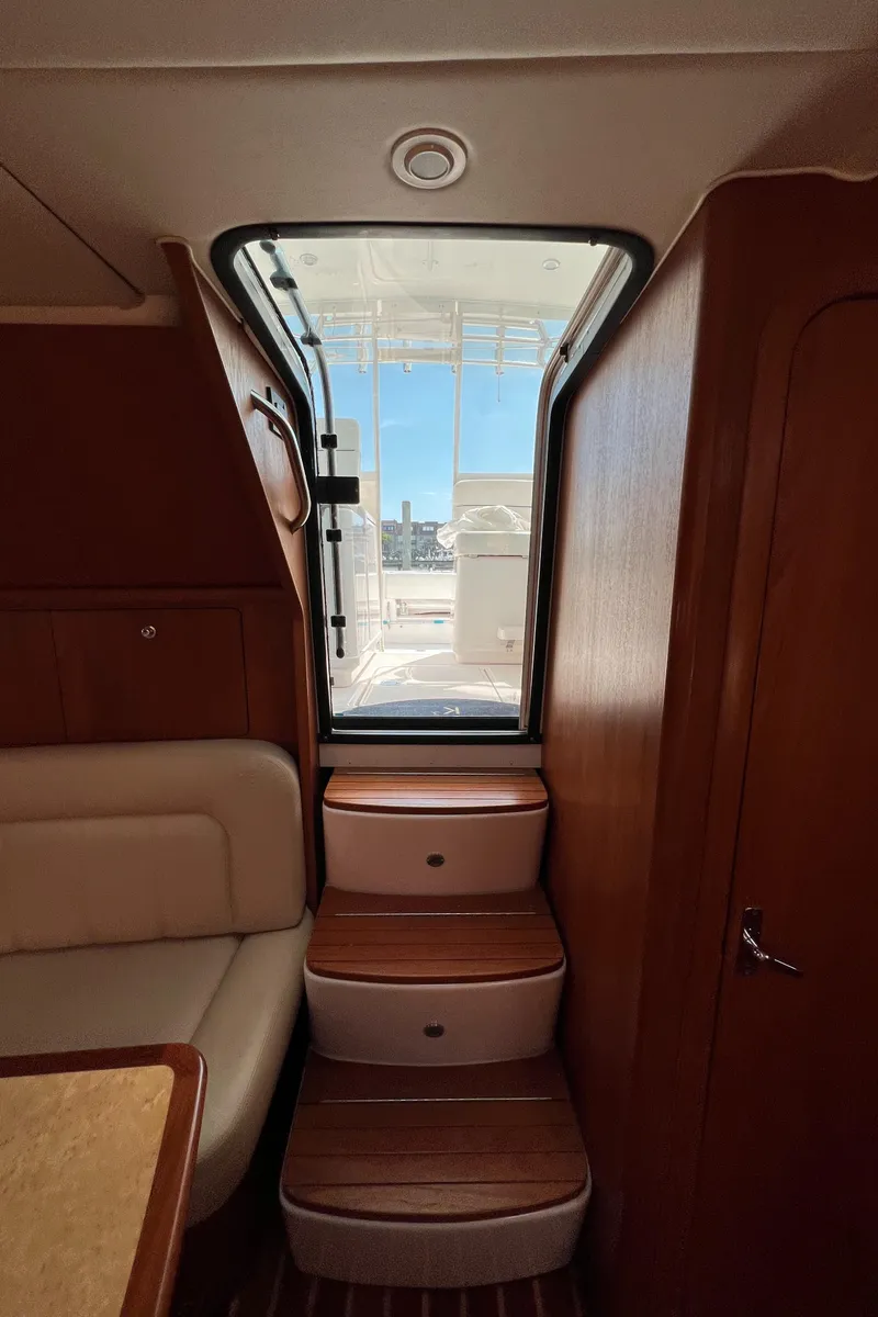 Slide: The Image of Interior stairs of 2004 Tiara Yachts 3200 Open leading to deck. - 30
