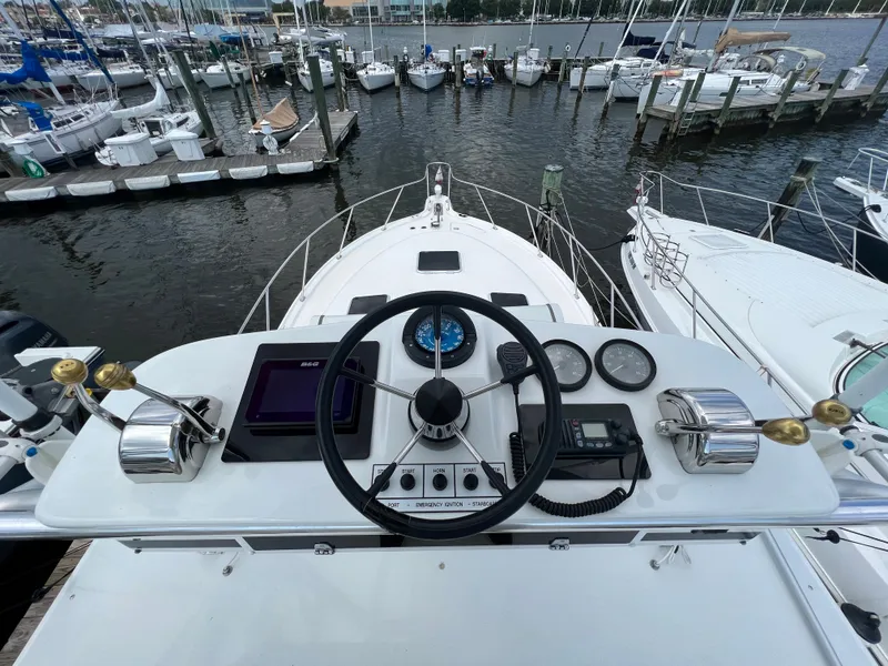 Slide: The Image of 2004 Tiara Yachts 3200 Open helm station with marina view - 32