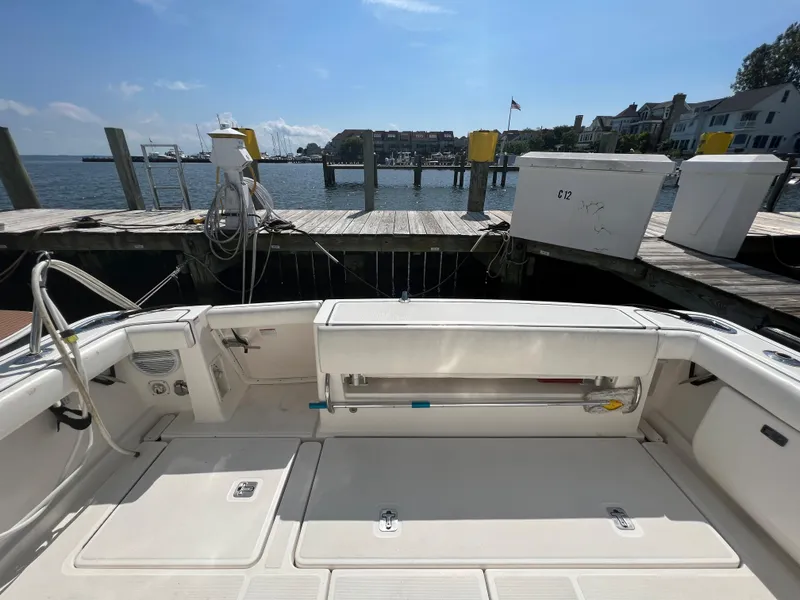 Slide: The Image of 2004 Tiara Yachts 3200 Open at dock, spacious deck, waterfront view. - 6