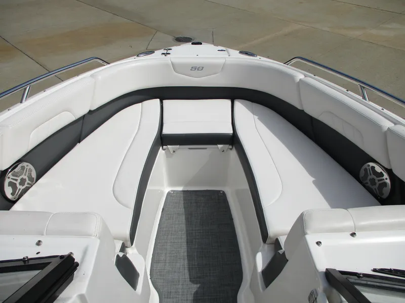 Slide: The Image of Interior view of 2015 Chaparral 257 SSX boat with gray and white seating. - 7