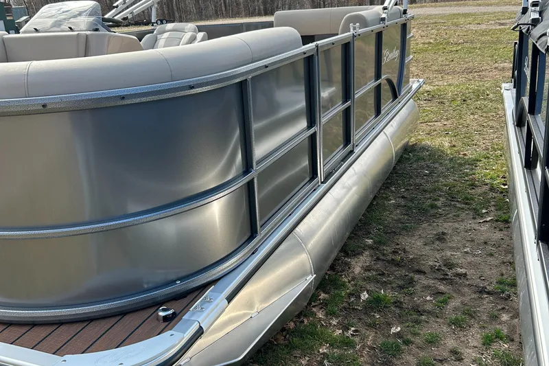 Slide: The Image of 2024 Bentley Pontoons LE 180 CR pontoon boat on grassy area. - 2