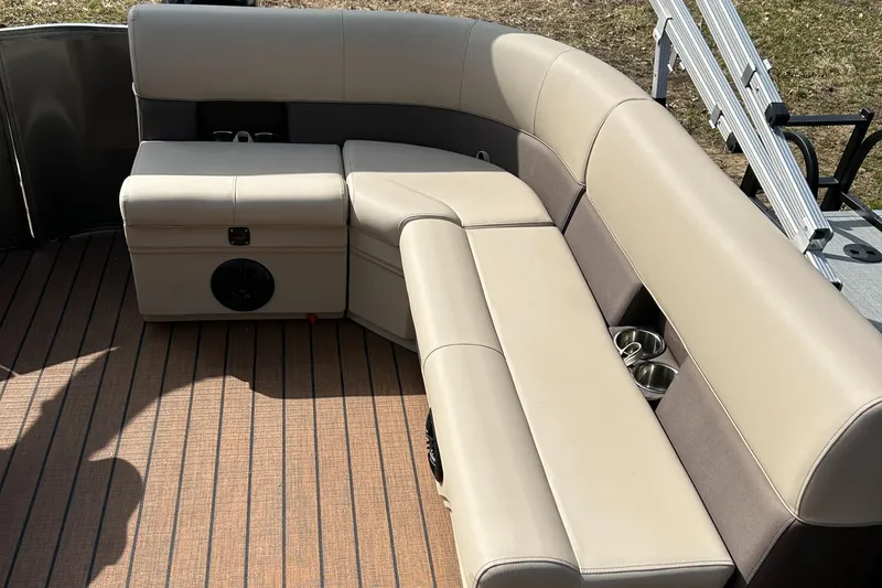 Slide: The Image of 2024 Bentley Pontoons LE 180 CR interior seating with beige upholstery. - 6