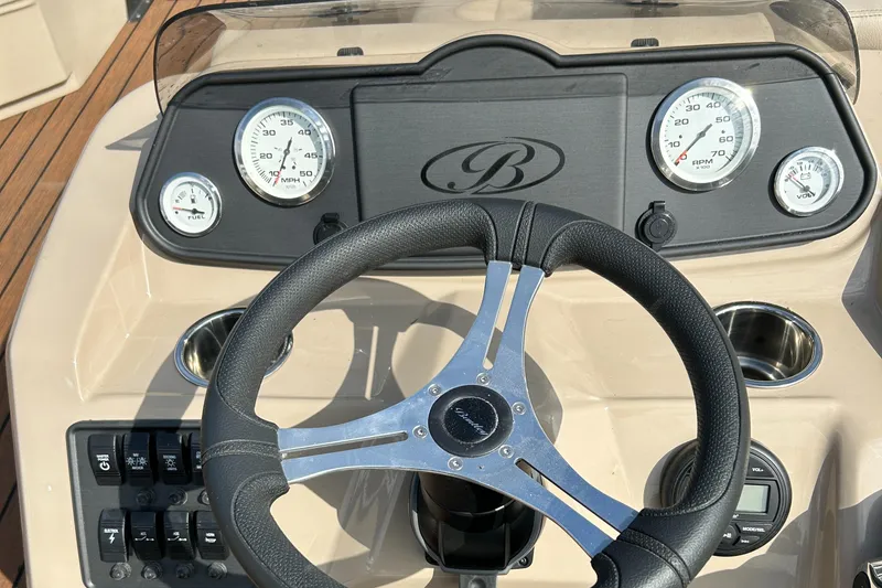 Slide: The Image of 2024 Bentley Pontoons LE 180 CR dashboard and steering wheel. - 8